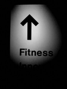 Black and white photo of fitness sign.