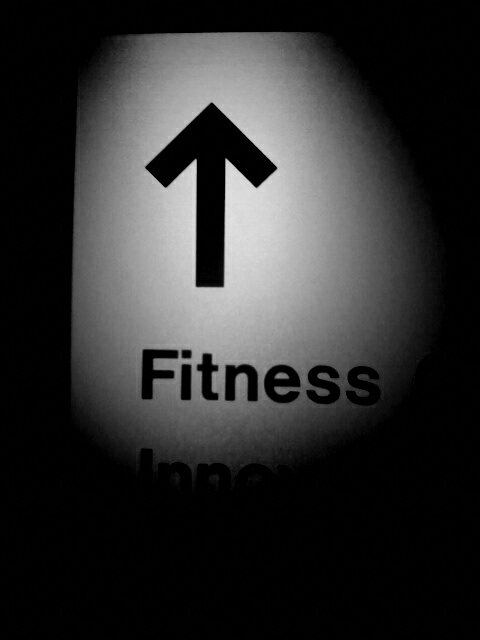 Black and white photo of fitness sign.