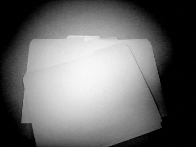 Black and white photo of file folders.