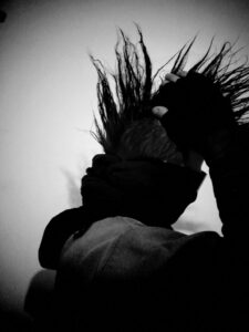 Black and white photo of stranger's spiked hair.