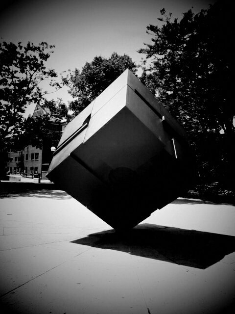 Black and white photo of the cube sculpture.