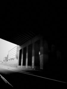 Black and white photo of I-75 freeway underpass.