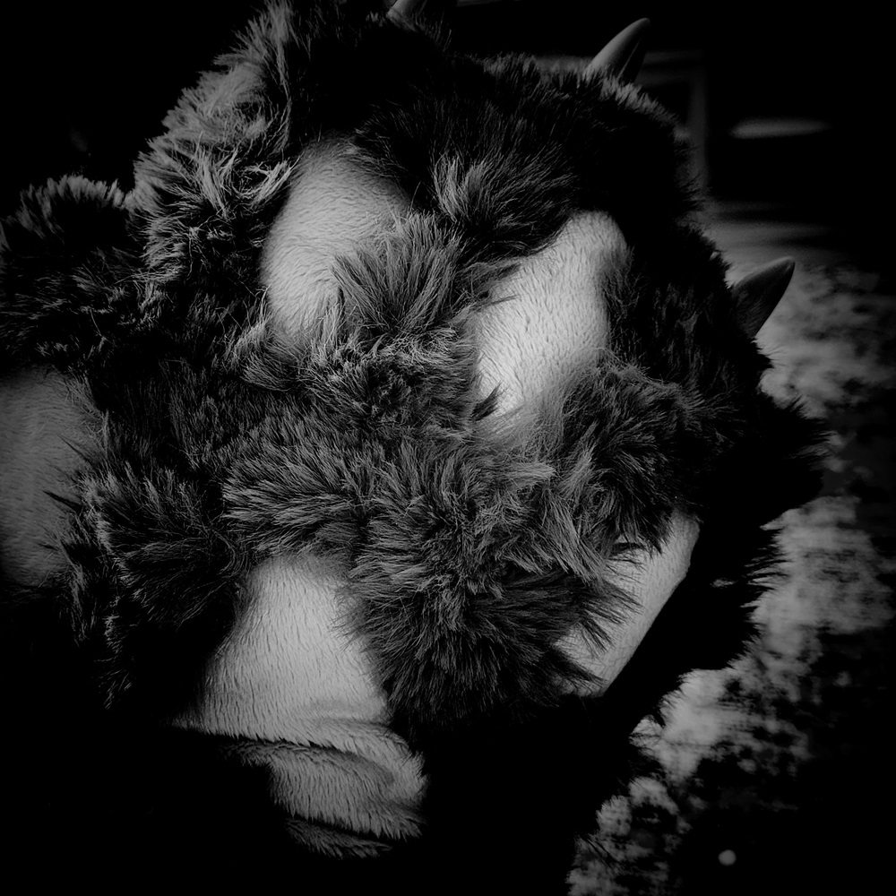 Black and white photo of homemade fursuit paw.