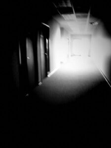 Black and white photo of hallway.