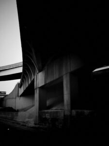 Black and white photo of freeway overpass on I-75 in Detroit.