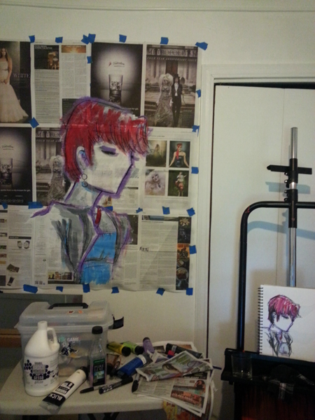 Photo of finished artwork "Trista" painting on newspaper taped to wall. Easel is sitting to the right with sketchbook art of original drawing shown.