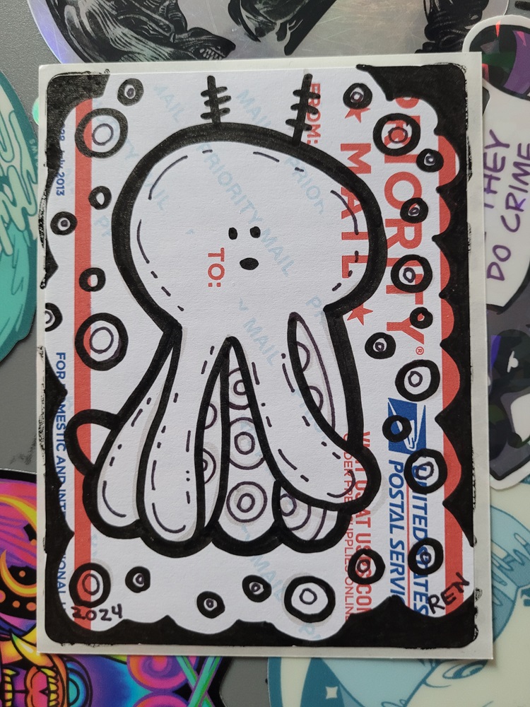 Marker art of octopus with a derpy cartoon face on sticker.